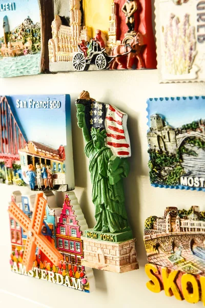 Magnets on refrigerator from travelling - stock photo, souvenir shopping — Stock Photo, Image