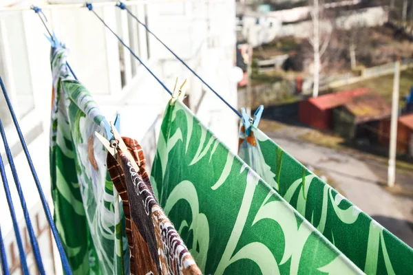 Waschespinne, Hung up to Dry, Clothes dry on a rope in the balcony