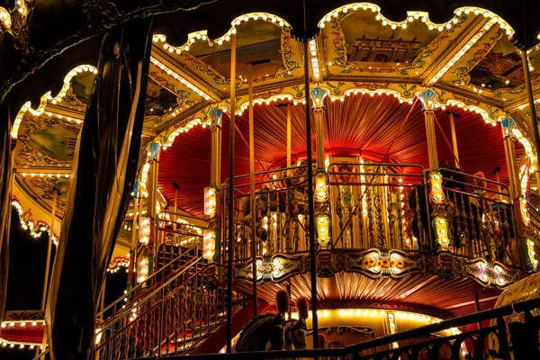 Carousel merry-go-round with light at night — 스톡 사진