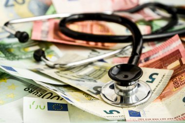 stethoscope and the euro banknotes, Medical cost concept - Stethoscope on euro paper money bank notes