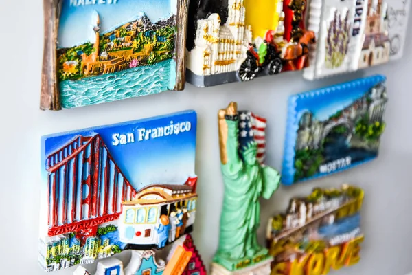 Magnets on refrigerator from travelling - stock photo, souvenir shopping — Stock Photo, Image