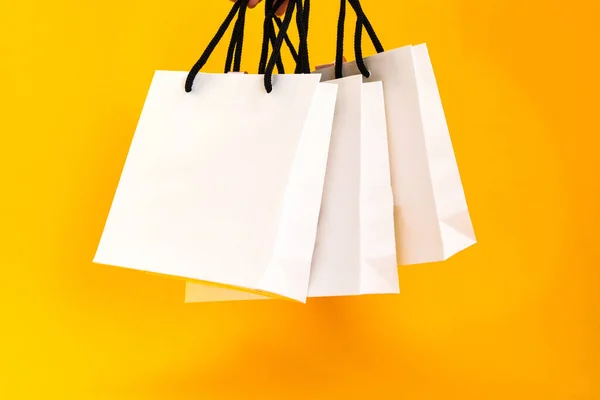 Set White Paper Bags Shopping Yellow Background Mockup Design Copy — Stockfoto