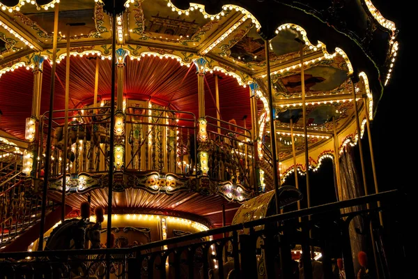 Carousel merry-go-round with light at night — 스톡 사진