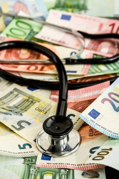 stethoscope and the euro banknotes, Medical cost concept - Stethoscope on euro paper money bank notes Euro banknotes background : Banking Account, Investment Analytic research data economy, trading, Business company concept.