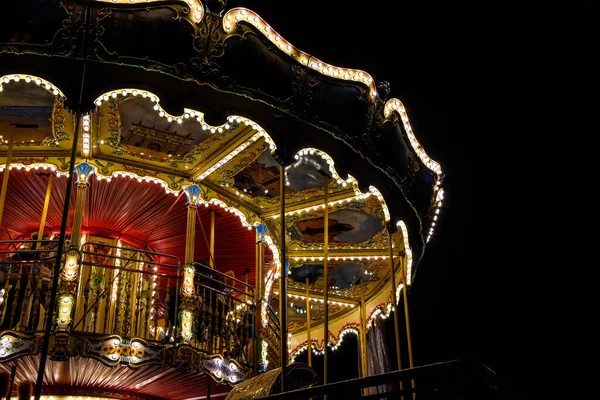 Carousel merry-go-round with light at night — Stock Photo, Image