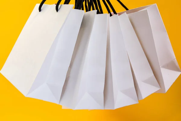Set White Paper Bags Shopping Yellow Background Mockup Design Copy — Stockfoto