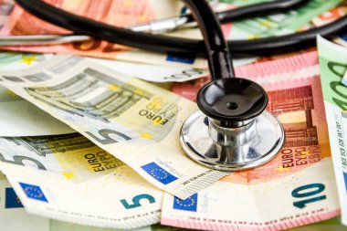 stethoscope and the euro banknotes, Medical cost concept - Stethoscope on euro paper money bank notes Euro banknotes background : Banking Account, Investment Analytic research data economy, trading, Business company concept.