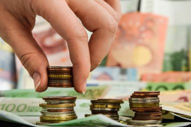 Hand putting coin to stack of coins. Business and Finance or Saving money concept, Money, Financial, Business Growth concept