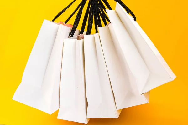 Set White Paper Bags Shopping Yellow Background Mockup Design Copy — Stockfoto