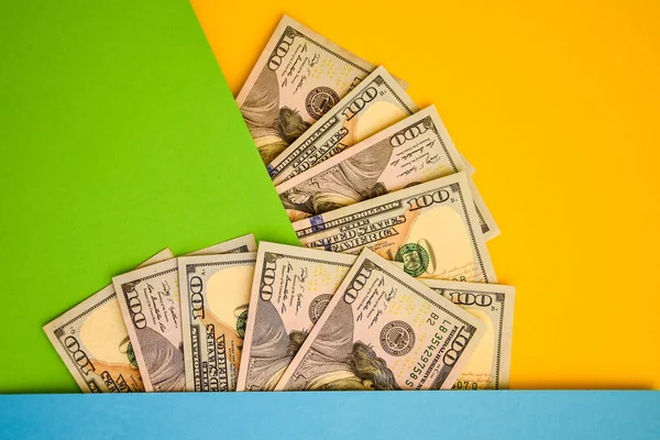 Cash Money on colorful background, Fan of 100 dollar bills on color background, copy space for you text, Save and money cocncept