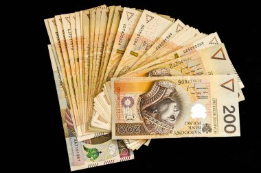 200 polish zloty - full set of banknotes of polish zloty isolated on black, Two Hundred polish zloty banknotes on a dark background close up
