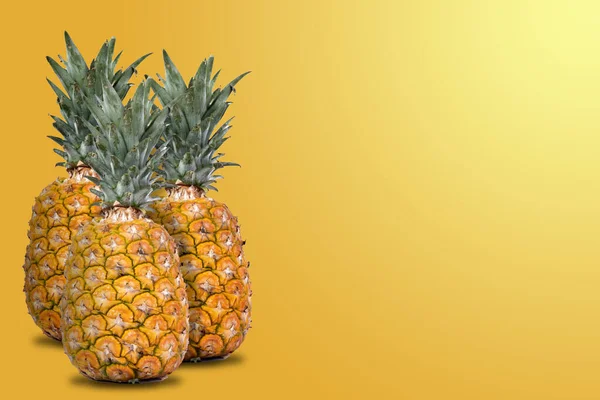 Group Whole Fresh Pineapples Orange Background Side Space Text — Stock Photo, Image