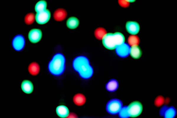 Röd och orange, grön, blå julbokeh. Abstrakt bakgrund — Stockfoto