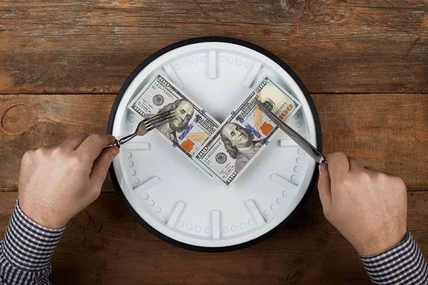 Hundred dollars on a clock. Cuts a dollars — 스톡 사진