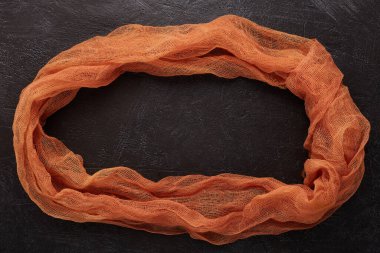 Cheeseclot, turuncu antika gazlı bez. Turuncu organza makro kumaş dokusu. Çember olun. Kopyala, metin alanı.