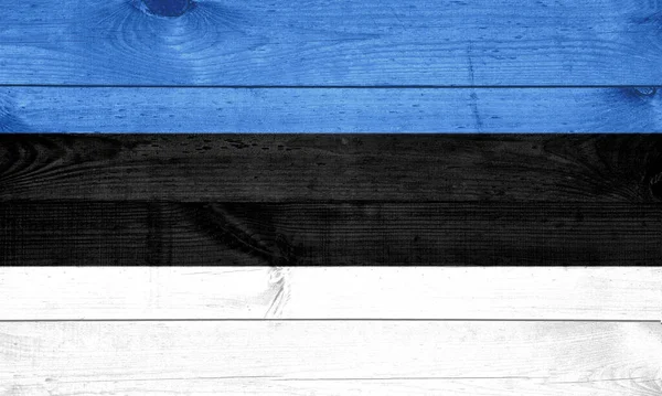 爱沙尼亚国旗涂在木制墙壁上作为背景 — 图库照片
