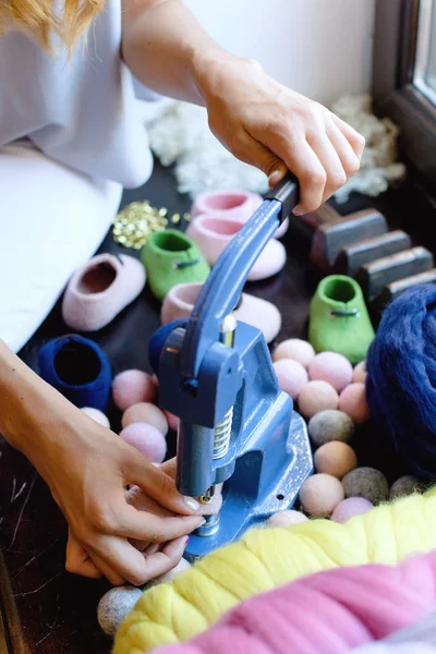 The process of working handmade shoes from merino wool.