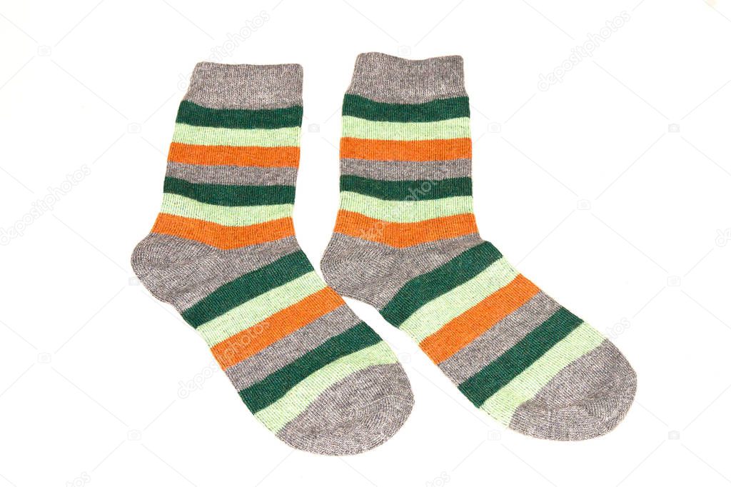 Pair of striped socks on white background