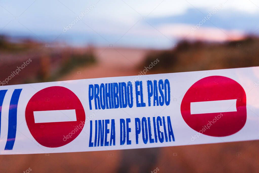 Police line with background blur effect. Quarantined public area, beach closed caused by pandemic disease situation. Quarantine globally spread infection. Stop COVID-19. Do not enter sign. Close-up. Coronavirus concept.