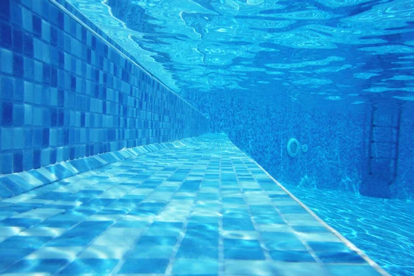 Underwater shot of stairs and tiles on pool bottom