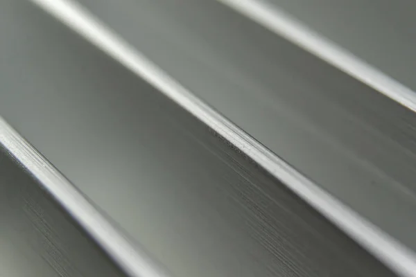 Symetric Close-up industrial realistic silver aluminum extrusion heatsink fins after industrial CNC routing processing — Stock Photo, Image