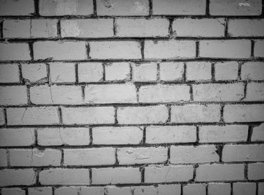 Beyaz tuğlalar ve gri beton oluşum simetrik kalıpları ile inşa edilmiş dramatik eski duvar arka planının izole edilmiş tek renkli yakın çekimi