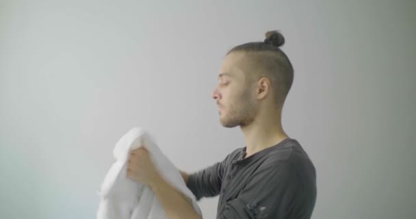 Young Caucasian Male Blond Hair Dries His Hands White Towel — Stock Video