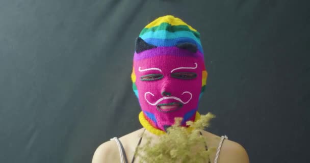 Young Latin Woman Using Mask Various Colors Playing Dried Flowers — Stock Video