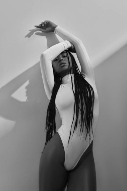 Fashion african model posing in studio in underwear. Beauty stylish portrait of trendy woman on white background