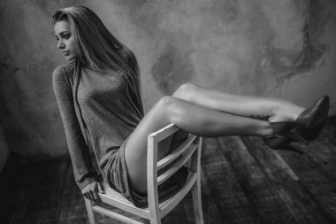 Stylish elegant blonde woman portrait. Sexy beauty fashion girl posing in studio on white wall. Elegant glamour model