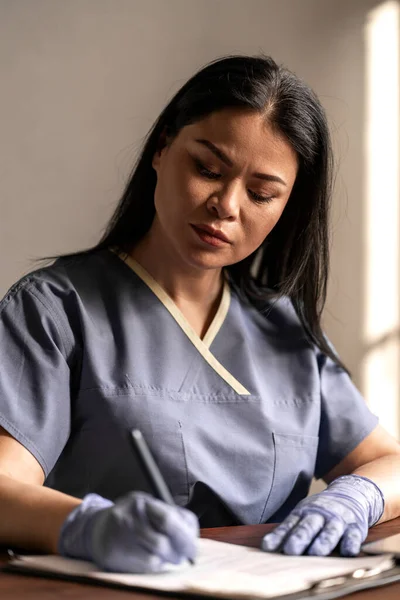 Asian Doctor Woman Write Documents Stock Picture