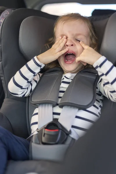 Cute small girl in car seat in the car — Stock Photo, Image