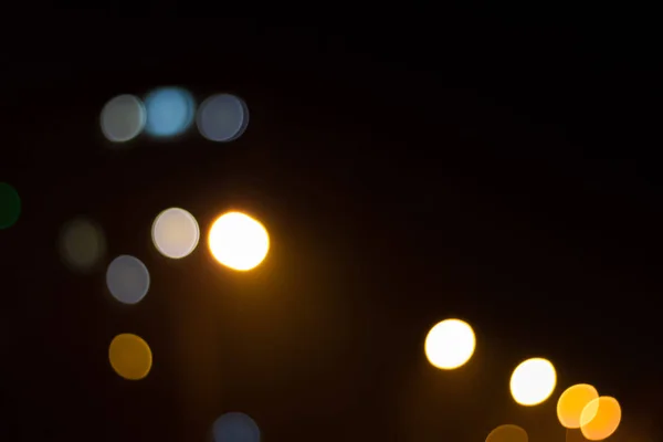 Abstract beeld van bokeh lichten in de stad. Met sterk geel licht — Stockfoto