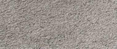 Parlak ince taneli kumlu doku, doğal yapı. Taş dokusuyla karşı karşıya. Ve ince kırıntı kahverengi ton arkaplan..