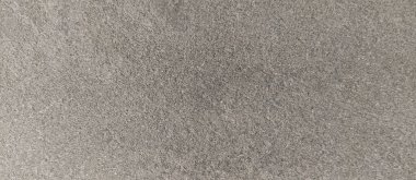 Parlak ince taneli kumlu doku, doğal yapı. Taş dokusuyla karşı karşıya. Ve ince kırıntı kahverengi ton arkaplan..