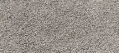 Parlak ince taneli kumlu doku, doğal yapı. Taş dokusuyla karşı karşıya. Ve ince kırıntı kahverengi ton arkaplan..