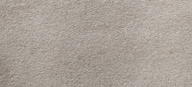 Parlak ince taneli kumlu doku, doğal yapı. Taş dokusuyla karşı karşıya. Ve ince kırıntı kahverengi ton arkaplan..