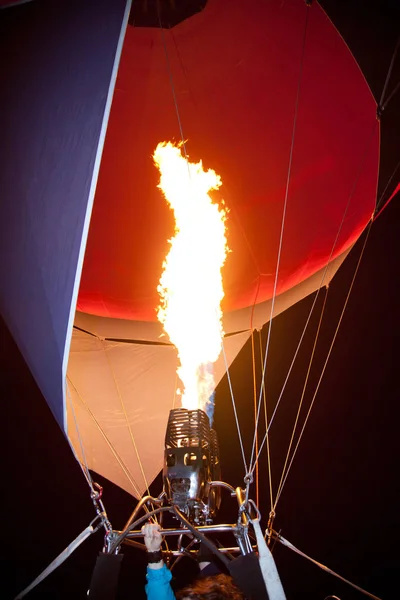 Air balloon part with fire close up in the evening sky