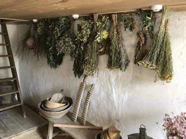 The interior of the country house drying herbs and old household items. Mobile photo in natural daylight.