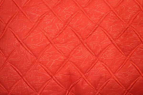赤い布に赤いステッチが入った織物 — ストック写真