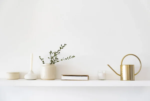 Minimalistic Scandinavian interior. Dishes on white shelves. White details in the interior.