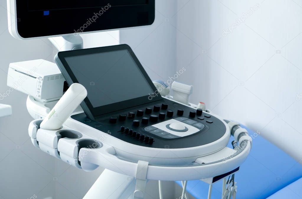 Medical room with ultrasound diagnostic equipment. Ultrasound machine.