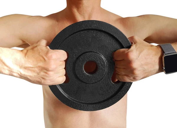 Close-up of young healthy man with big muscles holding disk weights in gym. — Stock Photo, Image