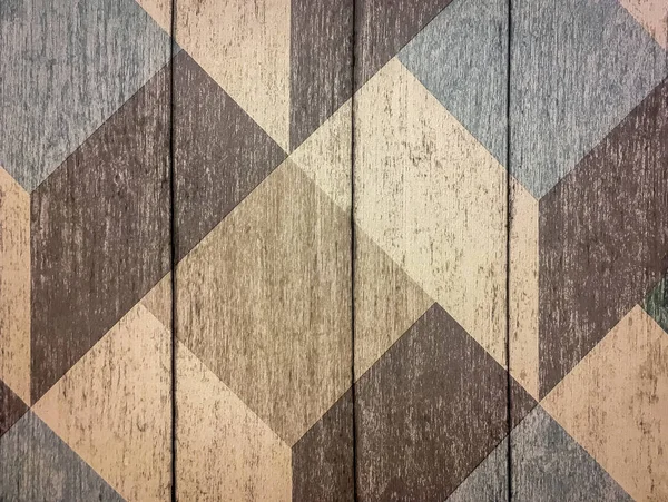 Envelhecido marrom escuro rachado pranchas de madeira com padrão geométrico closeup — Fotografia de Stock