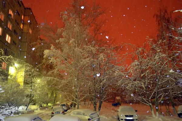 Snowfall in the evening. City. South Urals
