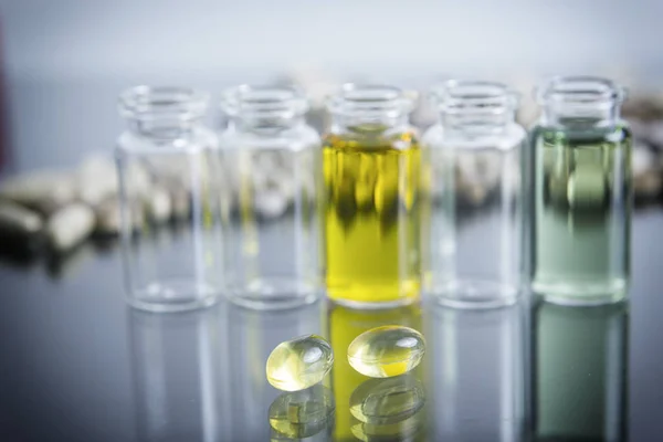 Capsules of oil, instruments in laboratory — Stock Photo, Image