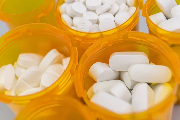 Pills boats orange with white tablets of different types — Stock Photo, Image