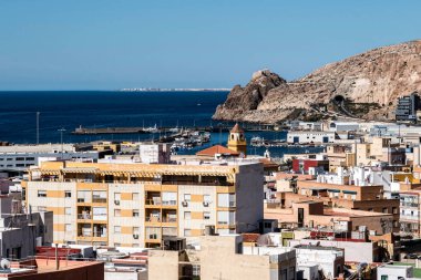 View from the fortress of Moorish houses and buildings along the port of Almeria, Andalusia, Spain clipart