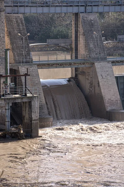Hydroelectric power station in Mengibar releasing water after heavy rains of winter, in the province of Jaen, Spain