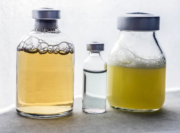 Several vials and syringe in laboratory, conceptual image — Stock Photo, Image